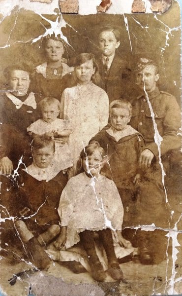 My mum's family in 1915 - she's the baby who went to school in the 1900's
