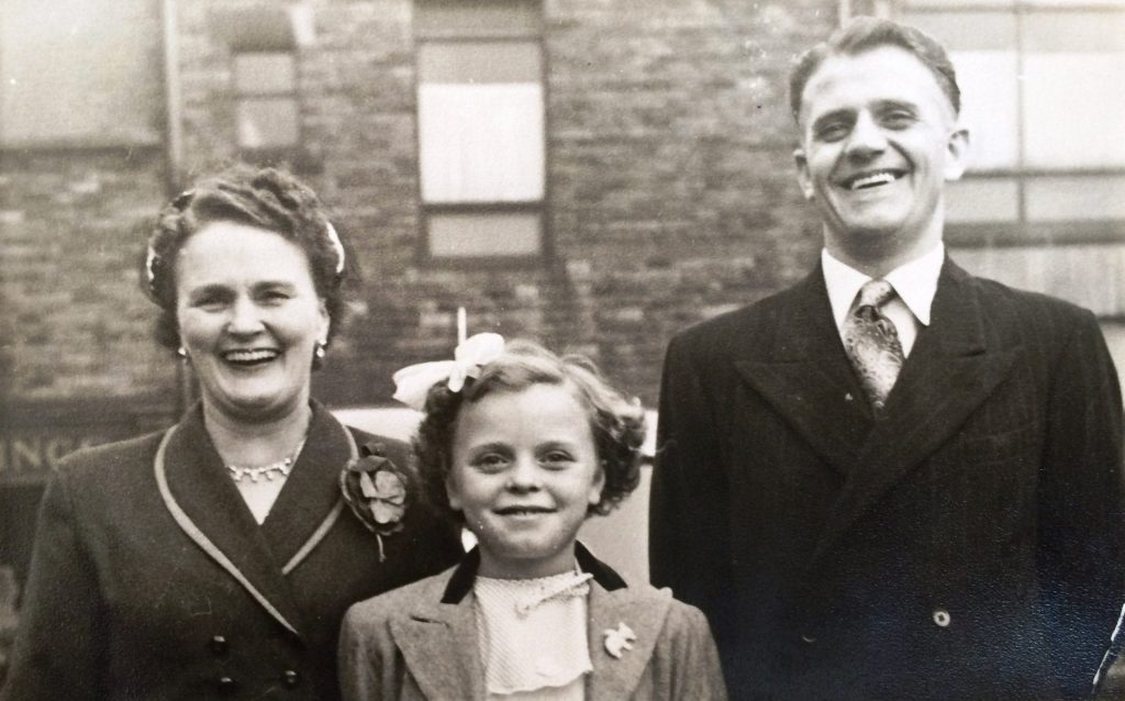 Young Chrissie with mum and dad, at Christmas Past