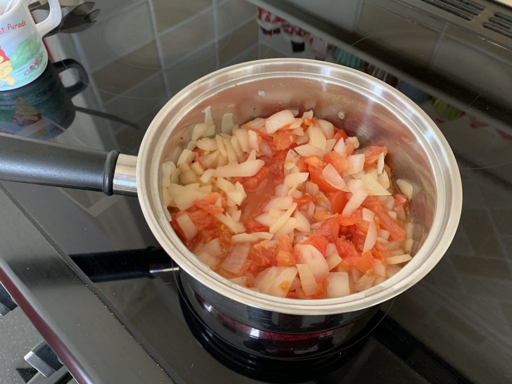 Cook the onions and tomatoes in a pan